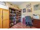 Well-lit home office features built-in bookshelves and ample desk space at 414 Bloomfield Dr, Spring Hill, FL 34609