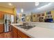 Stainless steel appliances and light wood cabinets in this kitchen at 414 Bloomfield Dr, Spring Hill, FL 34609