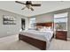 Main bedroom with king-size bed and walk-in closet at 4166 Sand Ridge Blvd, Spring Hill, FL 34609