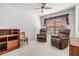 Relaxing sitting room with two armchairs and a wooden cabinet at 4222 Northampton Dr, New Port Richey, FL 34653