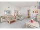Open living room with neutral decor and access to a patio at 4222 Northampton Dr, New Port Richey, FL 34653
