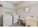 Functional laundry room with washer, dryer, and utility sink at 4222 Northampton Dr, New Port Richey, FL 34653