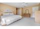 Large main bedroom with king-size bed, ceiling fan, and ample closet space at 4222 Northampton Dr, New Port Richey, FL 34653