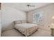 Cozy bedroom with double bed, window with shutters, and ceiling fan at 4222 Northampton Dr, New Port Richey, FL 34653