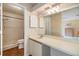 Clean bathroom with a vanity, toilet, and shower at 4222 Northampton Dr, New Port Richey, FL 34653