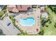 Relaxing community pool area with a spa and plenty of lounge chairs at 4222 Northampton Dr, New Port Richey, FL 34653