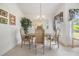 Bright dining room featuring a round table with four chairs and a chandelier at 4222 Northampton Dr, New Port Richey, FL 34653