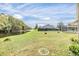 Spacious backyard with a pool and canal view, offering a relaxing outdoor space at 4222 Northampton Dr, New Port Richey, FL 34653