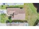 Aerial view of house with brown roof and green lawn at 4222 Northampton Dr, New Port Richey, FL 34653