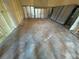 Unfinished bedroom with new flooring and closet at 6176 Island Dr, Weeki Wachee, FL 34607