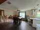 Dining area with a wooden table and four chairs under renovation at 6176 Island Dr, Weeki Wachee, FL 34607