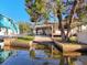 Waterfront home featuring carport and boat storage at 6176 Island Dr, Weeki Wachee, FL 34607