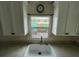 White kitchen sink with a modern faucet under cabinets at 6176 Island Dr, Weeki Wachee, FL 34607