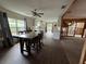 Open dining area with a view of the kitchen and backyard at 6176 Island Dr, Weeki Wachee, FL 34607