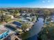Aerial view of waterfront homes with private docks and lush landscaping at 6176 Island Dr, Weeki Wachee, FL 34607