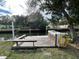Spacious wooden dock with built-in seating and storage at 6176 Island Dr, Weeki Wachee, FL 34607