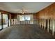 Living room undergoing renovation with wood paneling at 6176 Island Dr, Weeki Wachee, FL 34607
