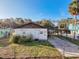 House with carport, boat, and fenced yard at 6176 Island Dr, Weeki Wachee, FL 34607