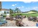 Brick patio with seating area overlooking golf course at 6489 Mulligan Ct, Spring Hill, FL 34606