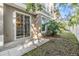 Private backyard with sliding glass door access at 7650 Red Mill Cir, New Port Richey, FL 34653