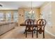Bright dining area with wood table and chairs near living room at 7650 Red Mill Cir, New Port Richey, FL 34653