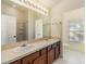 Bathroom boasts double vanity and a large mirror at 7650 Red Mill Cir, New Port Richey, FL 34653