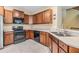 Kitchen with stainless steel appliances and wood cabinets at 7650 Red Mill Cir, New Port Richey, FL 34653