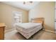 Cozy bedroom with window and wood-framed bed at 7650 Red Mill Cir, New Port Richey, FL 34653