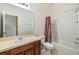 Simple bathroom with tub, toilet, and vanity at 7650 Red Mill Cir, New Port Richey, FL 34653