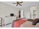 Bedroom with king-size bed, dresser, and view of the kitchen at 9320 Trowbridge Ct, New Port Richey, FL 34655