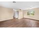 Living room with hardwood floors and neutral-toned walls at 1013 Marlow Ave, Spring Hill, FL 34606