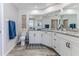 Bathroom with toilet, double vanity, and patterned rug at 12224 Mango Ct, Spring Hill, FL 34609