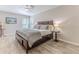 Bedroom with king-size bed, wood furniture and ceiling fan at 12224 Mango Ct, Spring Hill, FL 34609