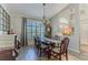 Formal dining room featuring a wooden table and chairs near a window at 12224 Mango Ct, Spring Hill, FL 34609