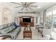 Open living room with a large sectional and built-in entertainment center at 12224 Mango Ct, Spring Hill, FL 34609