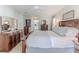 Main bedroom featuring a king-size bed and walk-in closet at 12224 Mango Ct, Spring Hill, FL 34609