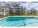 Relax and enjoy the Florida sunshine in this beautiful screened-in pool at 12224 Mango Ct, Spring Hill, FL 34609