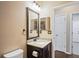 Bathroom with single sink and granite countertop at 15724 Peruvian Lily Ct, Brooksville, FL 34604