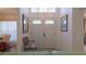 Bright entryway with double doors and a small bench at 3126 Double Eagle Ct, Spring Hill, FL 34606