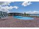 Community pool with a poolside bar and plenty of lounge chairs at 4620 Bay Blvd # 1148, Port Richey, FL 34668
