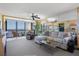 Relaxing living room with water views, sectional sofa, and fireplace at 4620 Bay Blvd # 1148, Port Richey, FL 34668