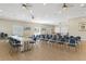 Spacious community room with tables and chairs for meetings at 4620 Bay Blvd # 1148, Port Richey, FL 34668