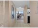 Condo entryway with tile floors, built-in storage, and view of living room and ocean at 4620 Bay Blvd # 1148, Port Richey, FL 34668