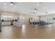 Community room features a kitchen and tables with chairs at 4620 Bay Blvd # 1148, Port Richey, FL 34668