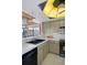 View of kitchen with updated appliances and tile flooring at 4620 Bay Blvd # 1148, Port Richey, FL 34668