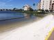 Private beach access with white sand and calm water views at 4620 Bay Blvd # 1148, Port Richey, FL 34668