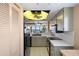 Bright kitchen with updated appliances and view to living room at 4620 Bay Blvd # 1148, Port Richey, FL 34668
