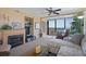 Living area featuring a fireplace, comfortable seating, and access to balcony with water views at 4620 Bay Blvd # 1148, Port Richey, FL 34668