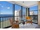 Bright sunroom with wicker chairs and water views at 4620 Bay Blvd # 1148, Port Richey, FL 34668