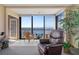 Living room with panoramic water views and access to balcony at 4620 Bay Blvd # 1148, Port Richey, FL 34668